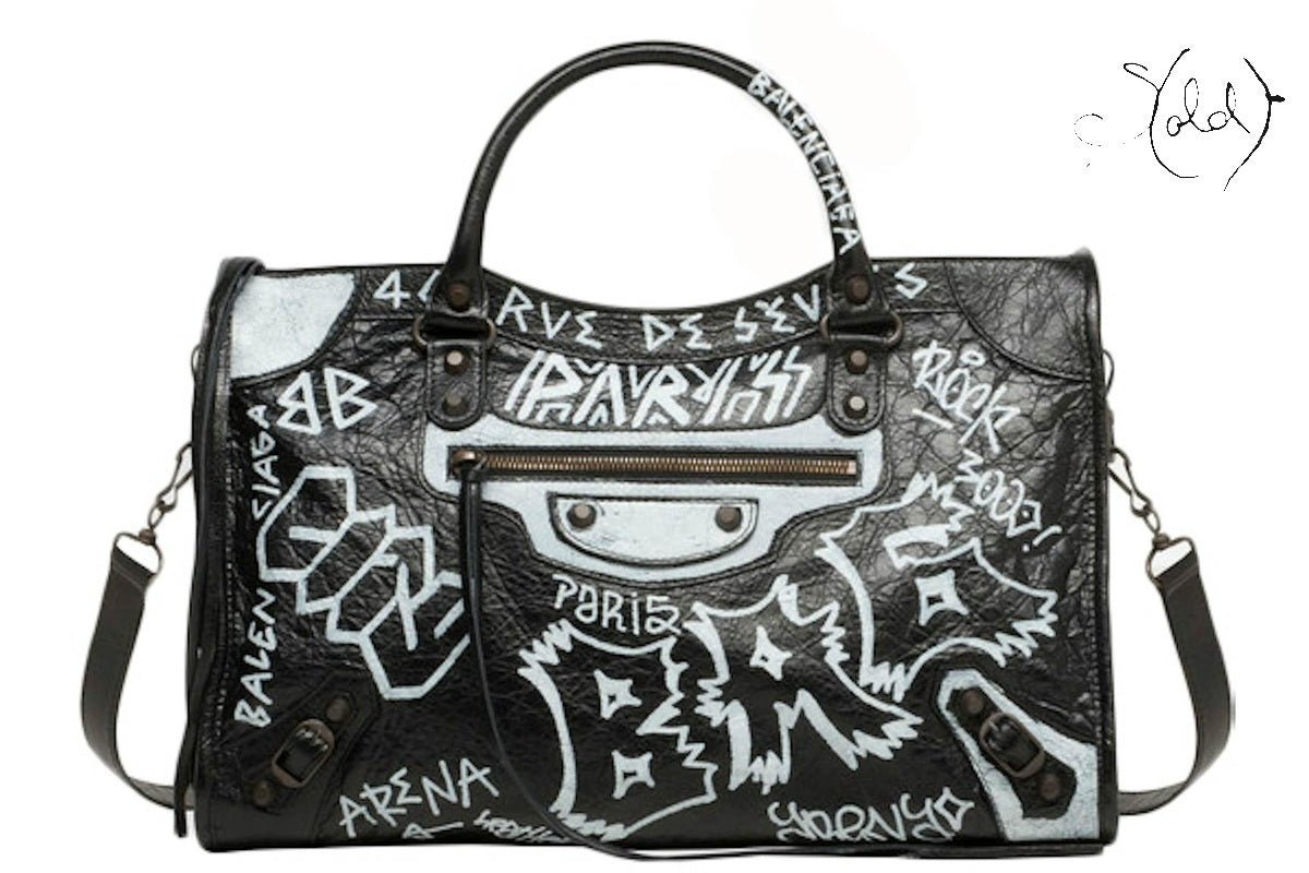 Balenciaga City graffiti bag centred on Sold Attire blog canvas.