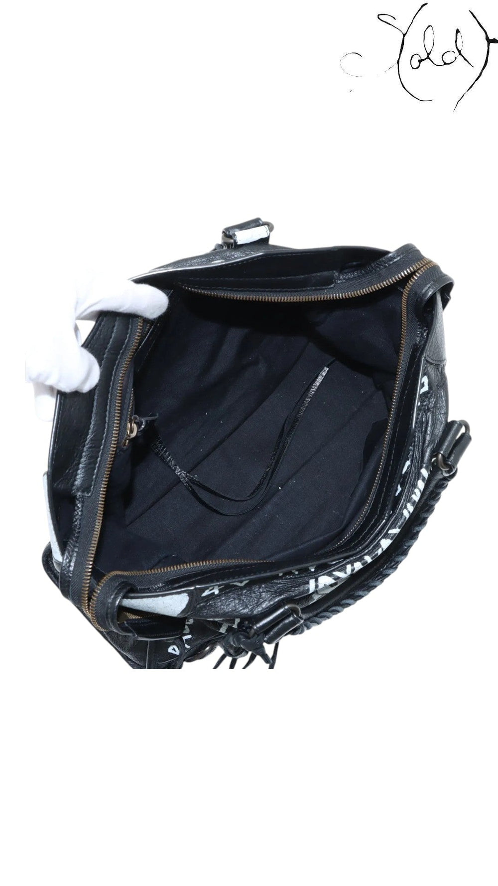 Sold Attire black agneau lambskin Balenciaga Graffiti City bag with white hand-painted graffiti and classic hardware.