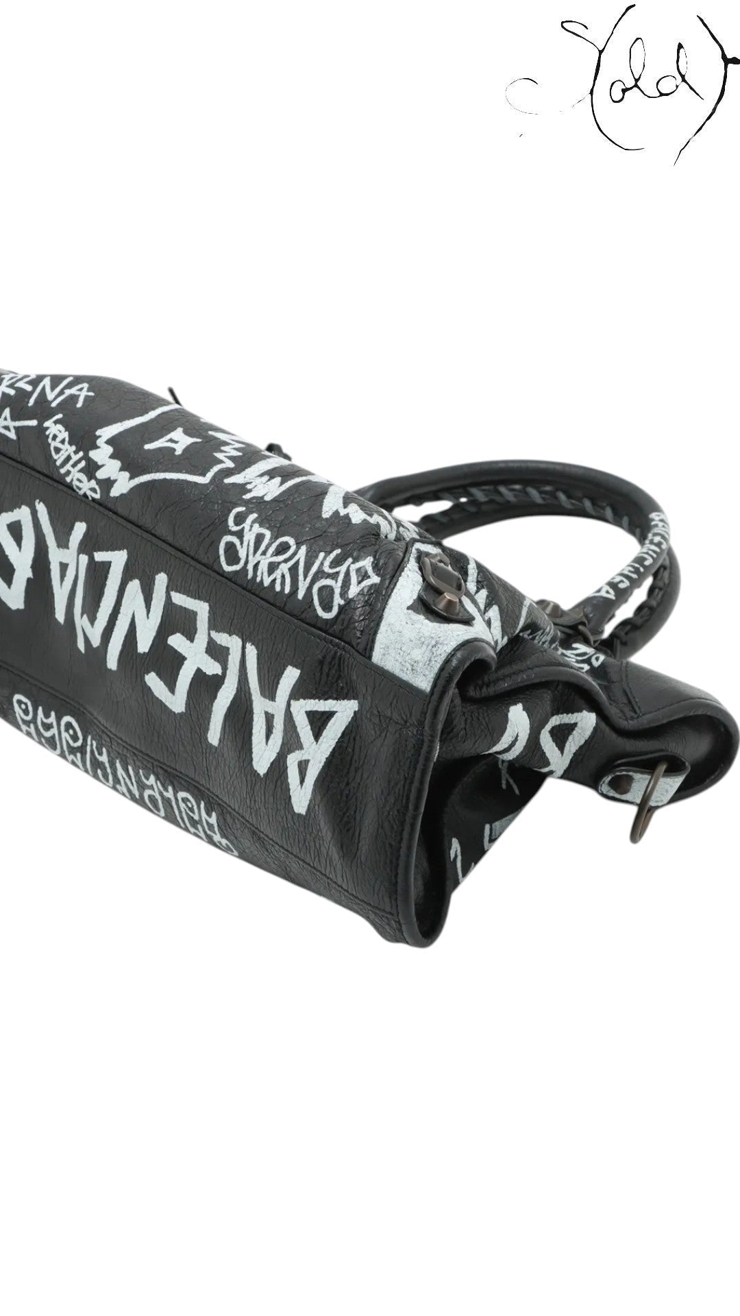 Sold Attire black agneau lambskin Balenciaga Graffiti City bag with white hand-painted graffiti details and classic hardware.