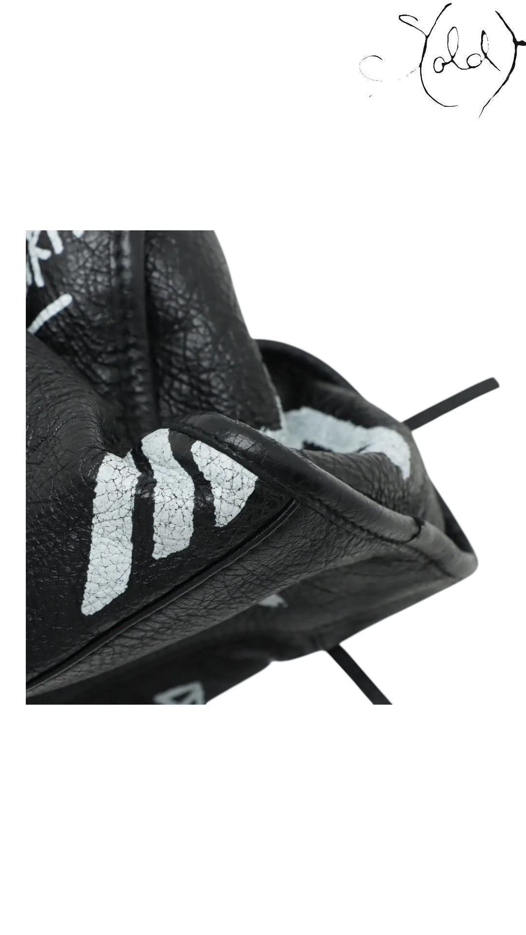 Sold Attire black agneau lambskin Balenciaga Graffiti City bag with hand-painted white graffiti details.