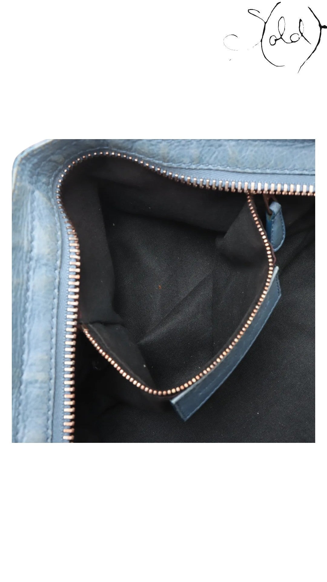Sold Attire Bleu Glacier lambskin Balenciaga Part Time bag interior with rose gold hardware zipper and black lining.