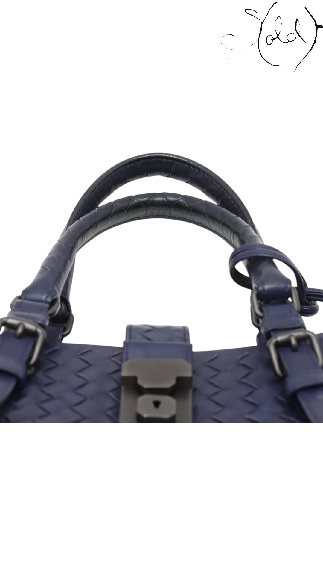 Sold Attire navy blue calfskin Bottega Veneta Roma small intrecciato 2-way bag with top handles and buckle closure.