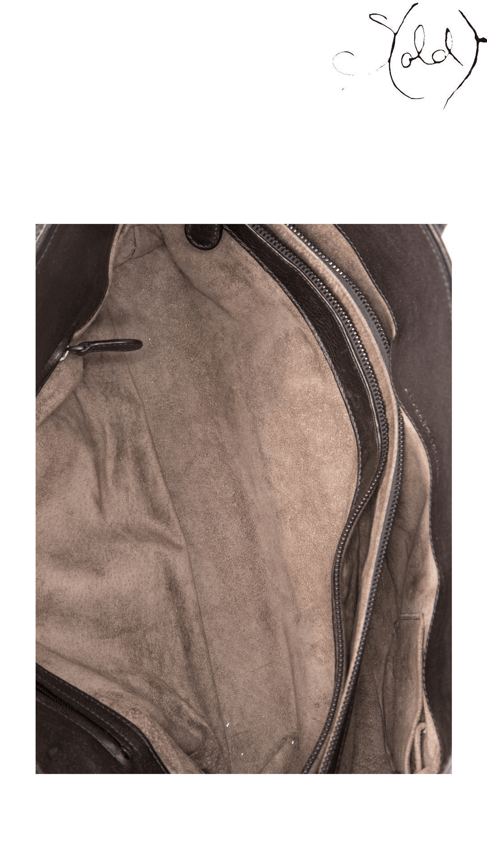 Suede interior of Bottega Veneta brown Intrecciato Cabat Large tote showing zipper and leather-trimmed pocket