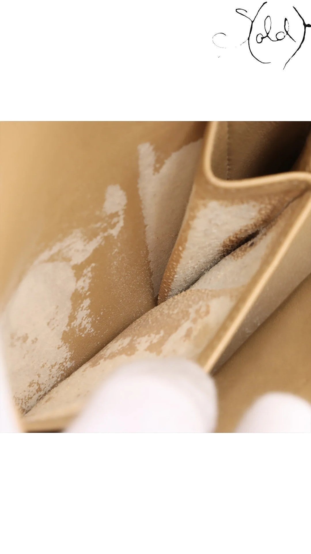Sold Attire beige lambskin Chanel Matelasse 23 interior showing signs of age-related dryness and peeling on the leather.