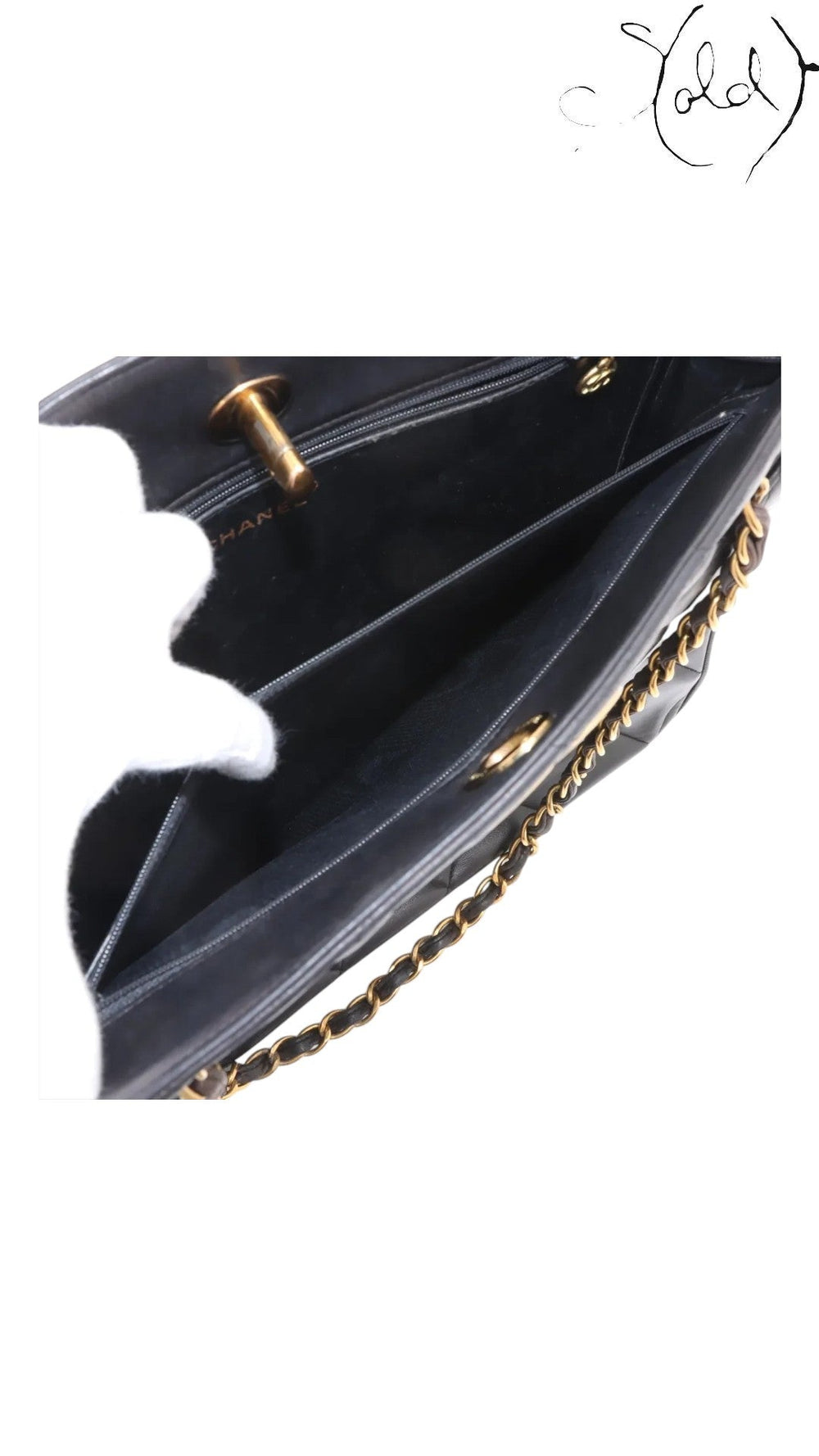 Sold Attire black quilted lambskin matelasse chain tote with gold hardware and interior pockets.