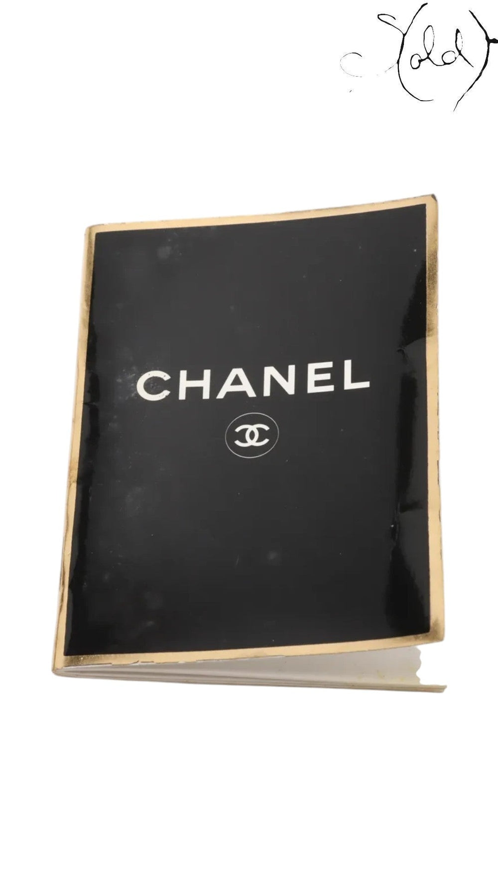 Sold Attire Chanel black lambskin chain tote booklet with gold trim.