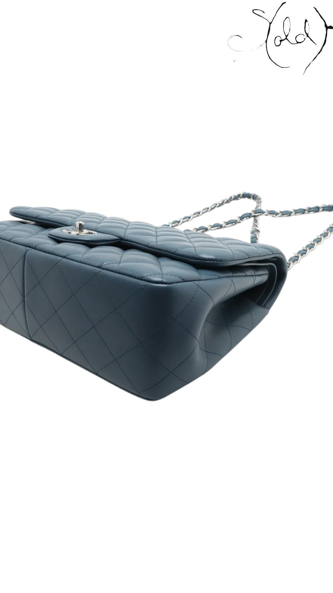 Sold Attire blue lambskin Chanel Deca Matelasse 30 double flap bag with silver-tone hardware and chain strap.