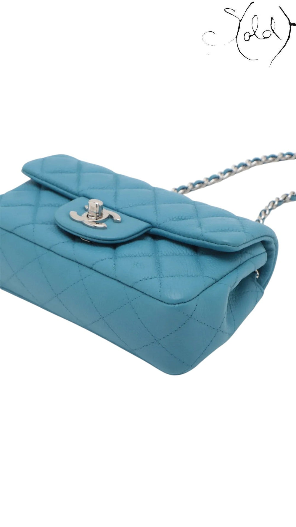 Sold Attire blue quilted caviar leather Chanel Extra Mini Classic Flap bag with silver-tone hardware and chain strap.
