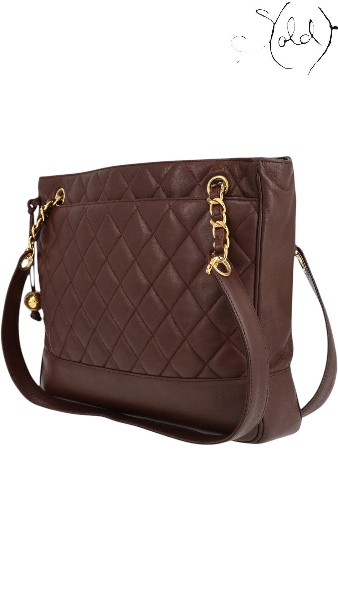 Sold Attire bordeaux lambskin matelasse chain tote with gold hardware and Coco Ball charm, circa 1991.