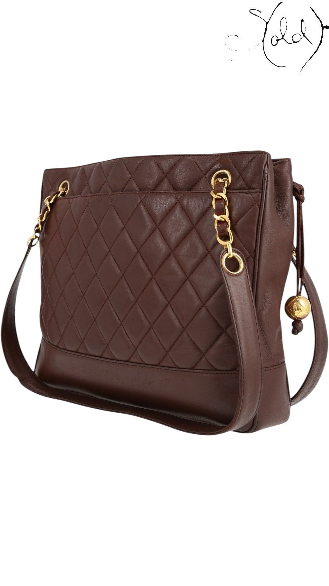 Sold Attire bordeaux lambskin Chanel Matelasse Chain Tote with gold hardware and Coco Ball charm, circa 1991.