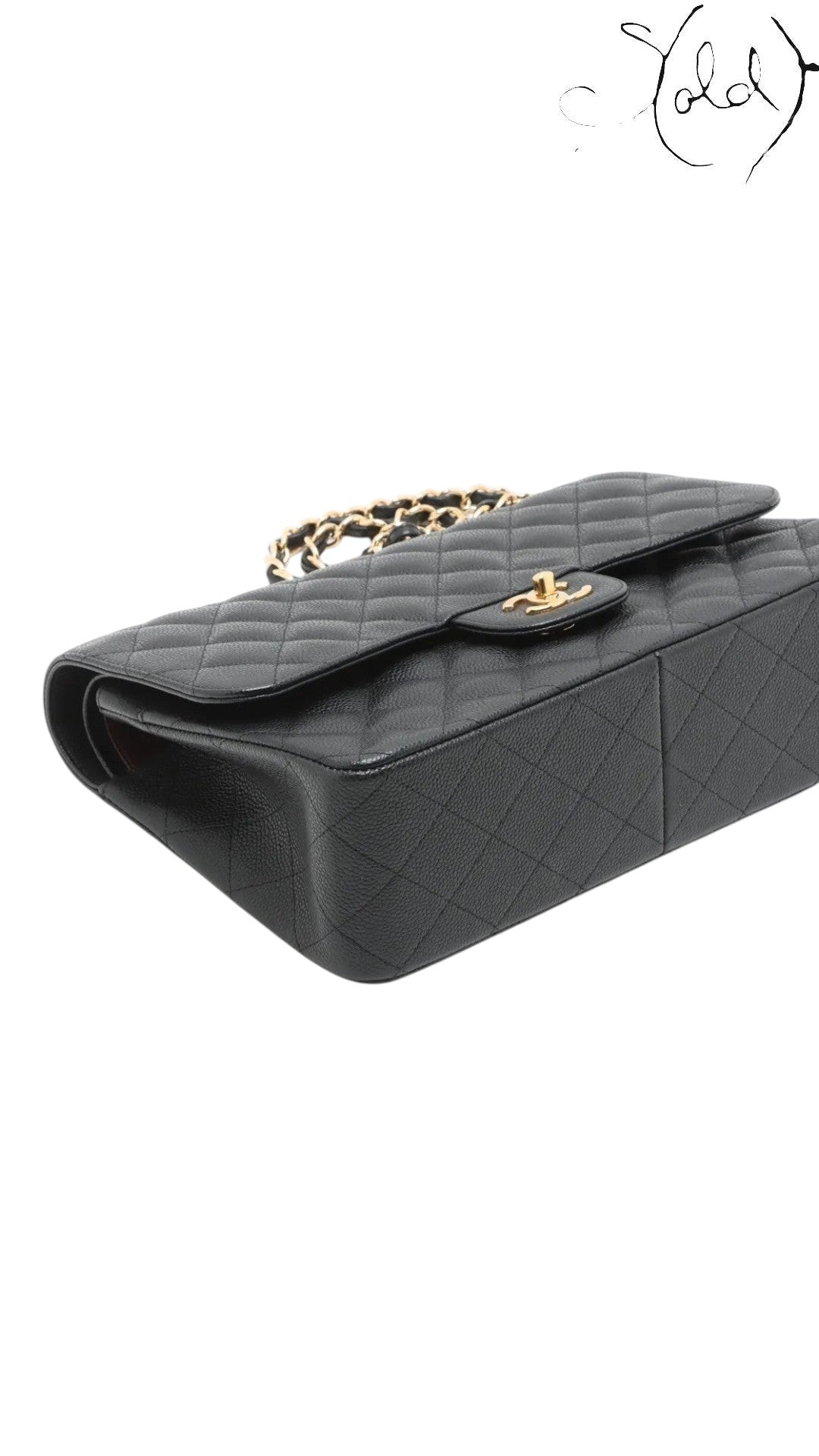 Sold Attire black caviar leather Chanel Jumbo Classic Double Flap bag with gold hardware and chain strap.