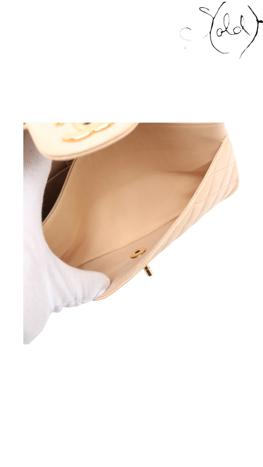 Sold Attire beige lambskin Chanel Medium Classic Double Flap bag interior with gold hardware turnlock.