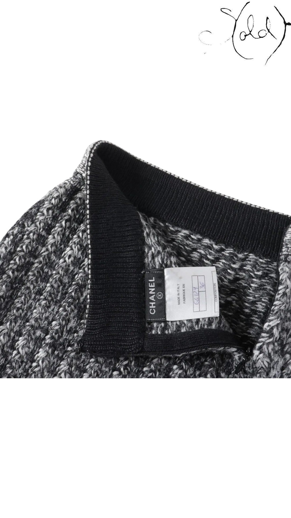 Sold Attire black and grey marled knit Chanel skirt with black ribbed waistband and trim. Features a Chanel logo tag and size 36 label.
