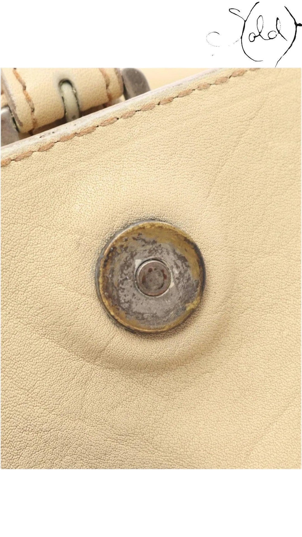 Sold Attire beige calf leather Dior Gaucho shoulder bag detail showing the silver-tone magnetic hardware closure