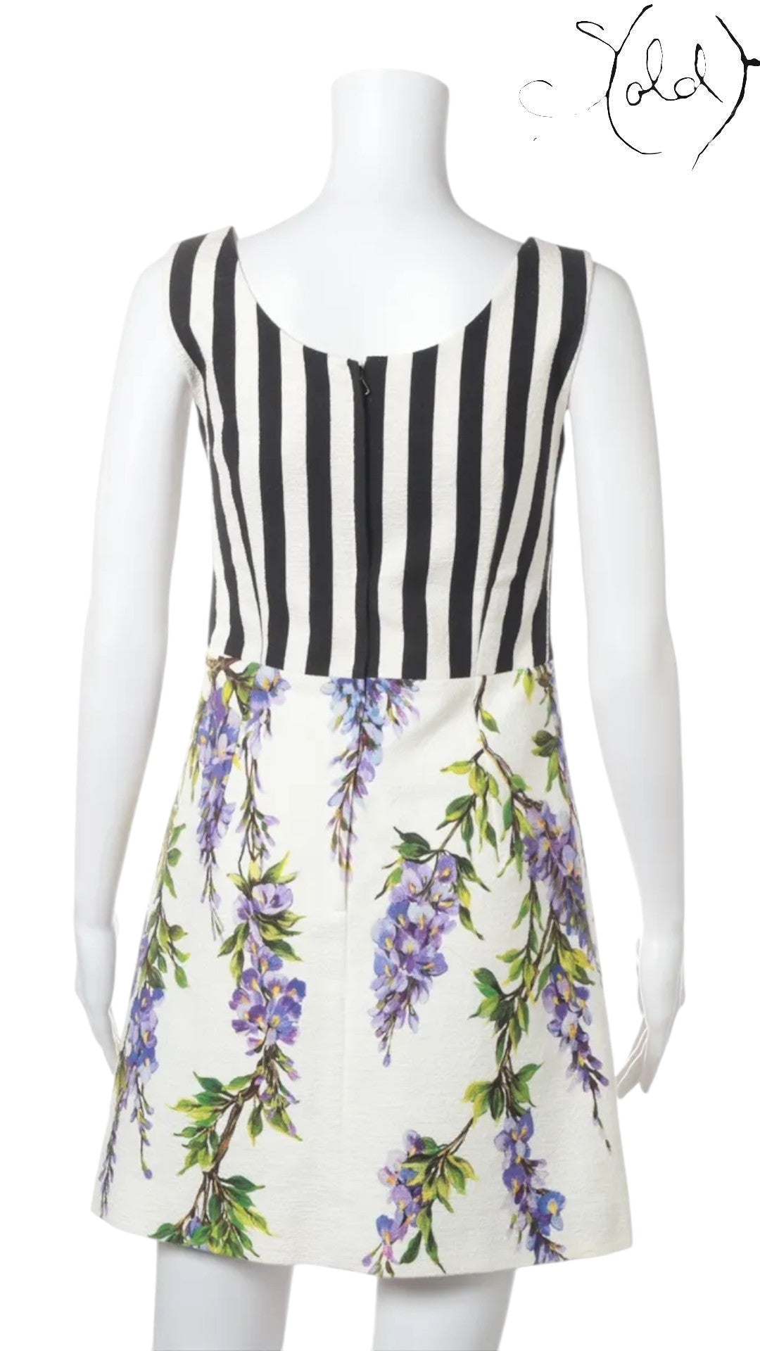 Sold Attire: Dolce & Gabbana sleeveless white dress with purple wisteria print and black and white striped bodice.