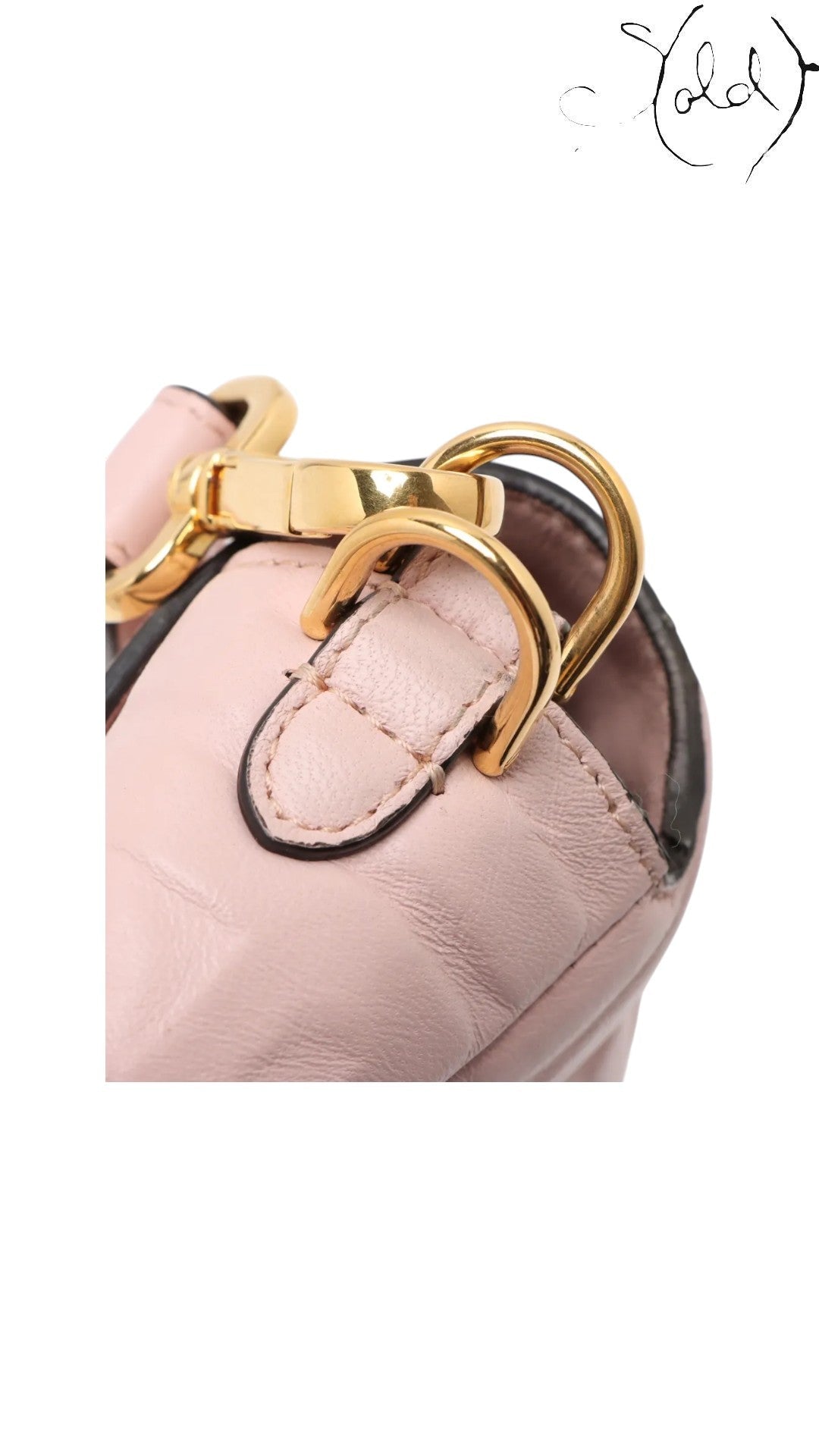 Sold Attire pink embossed calfskin Fendi Mamma Baguette with gold-tone hardware and FF jacquard motif.