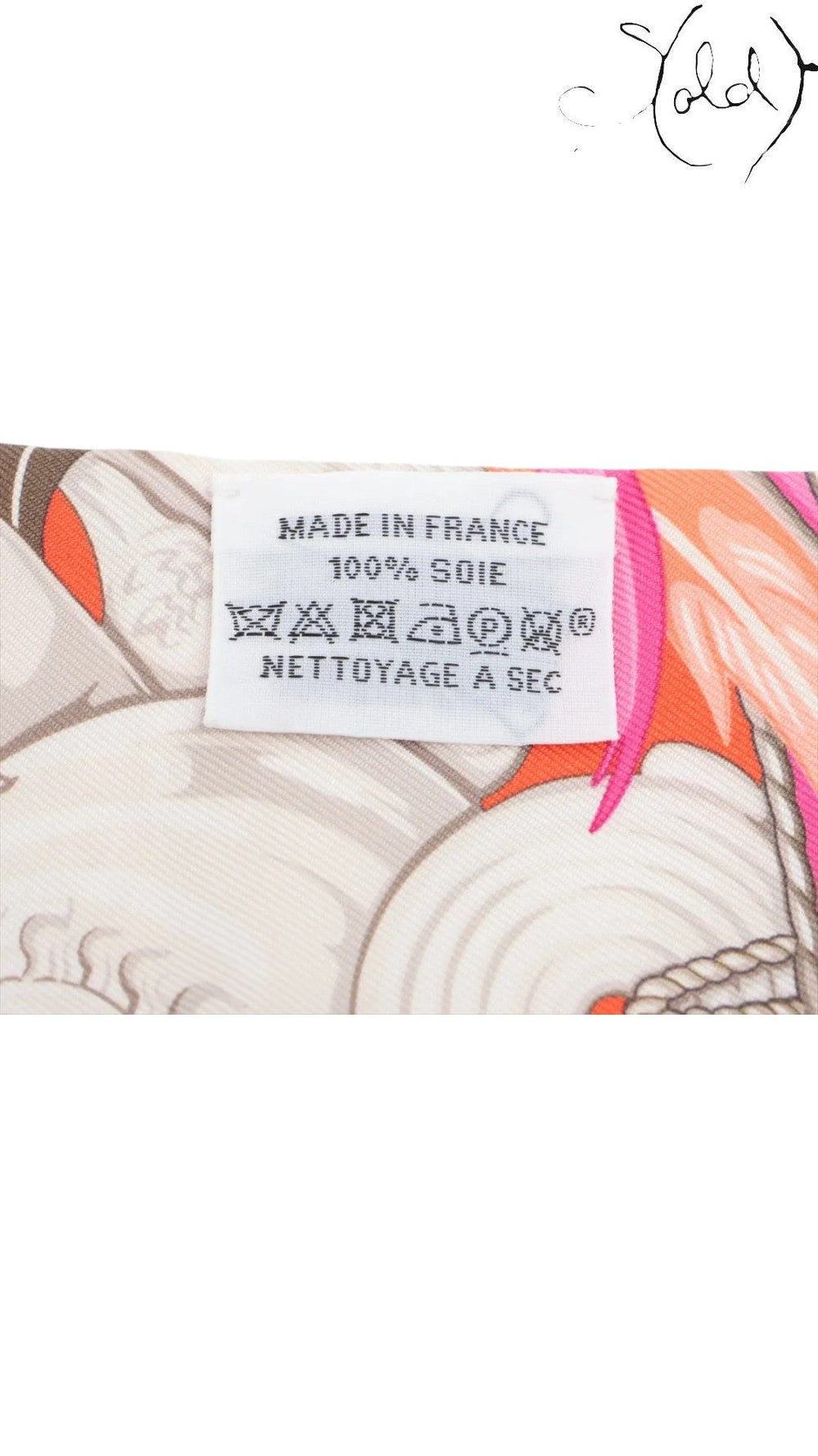 Sold Attire Hermes Twilly Danse Pacifique silk scarf care label showing 100% silk and Made in France details.