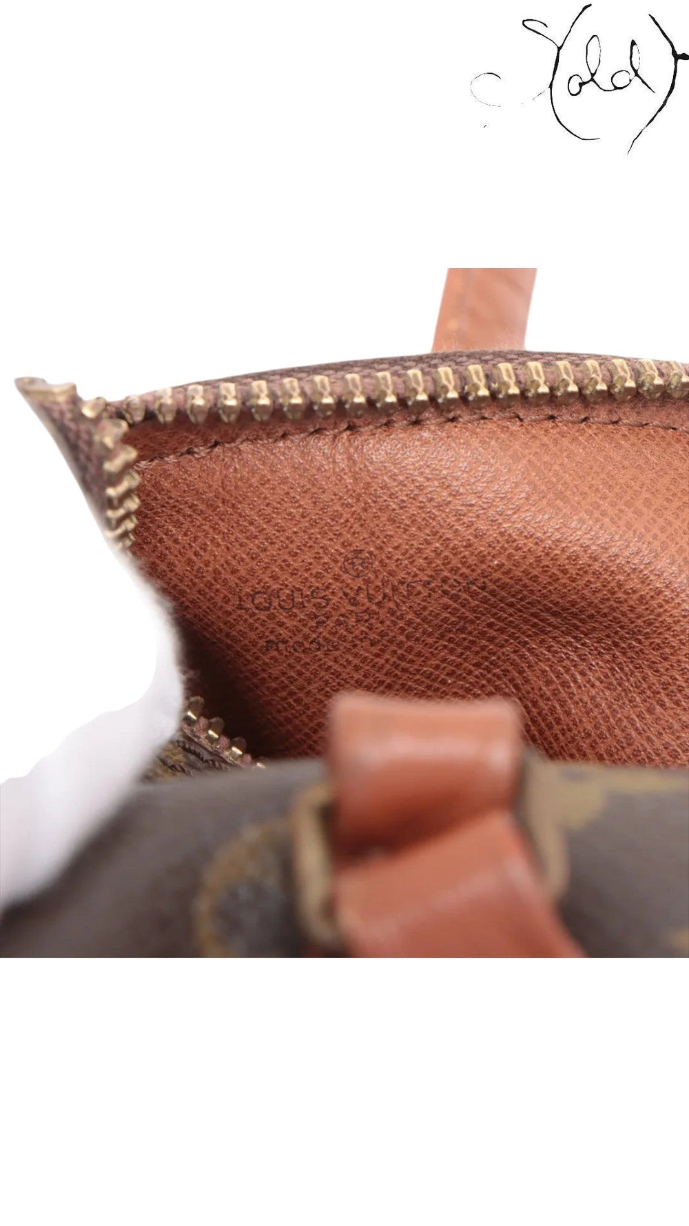Sold Attire Louis Vuitton Monogram Papillon 30 bag interior showing brown coated canvas lining with embossed logo and brass zipper.