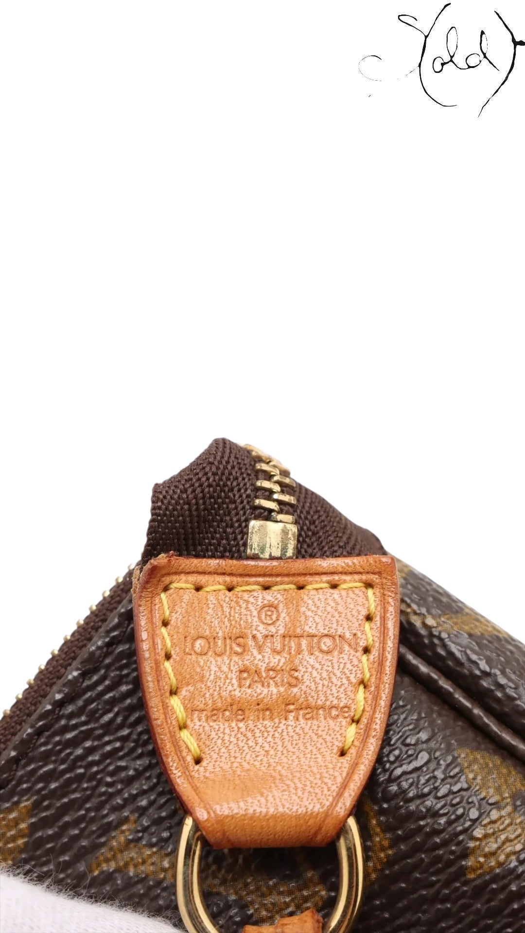 Sold Attire Louis Vuitton Monogram Pochette Accessoires M51980, brown coated canvas with gold hardware and leather trim.