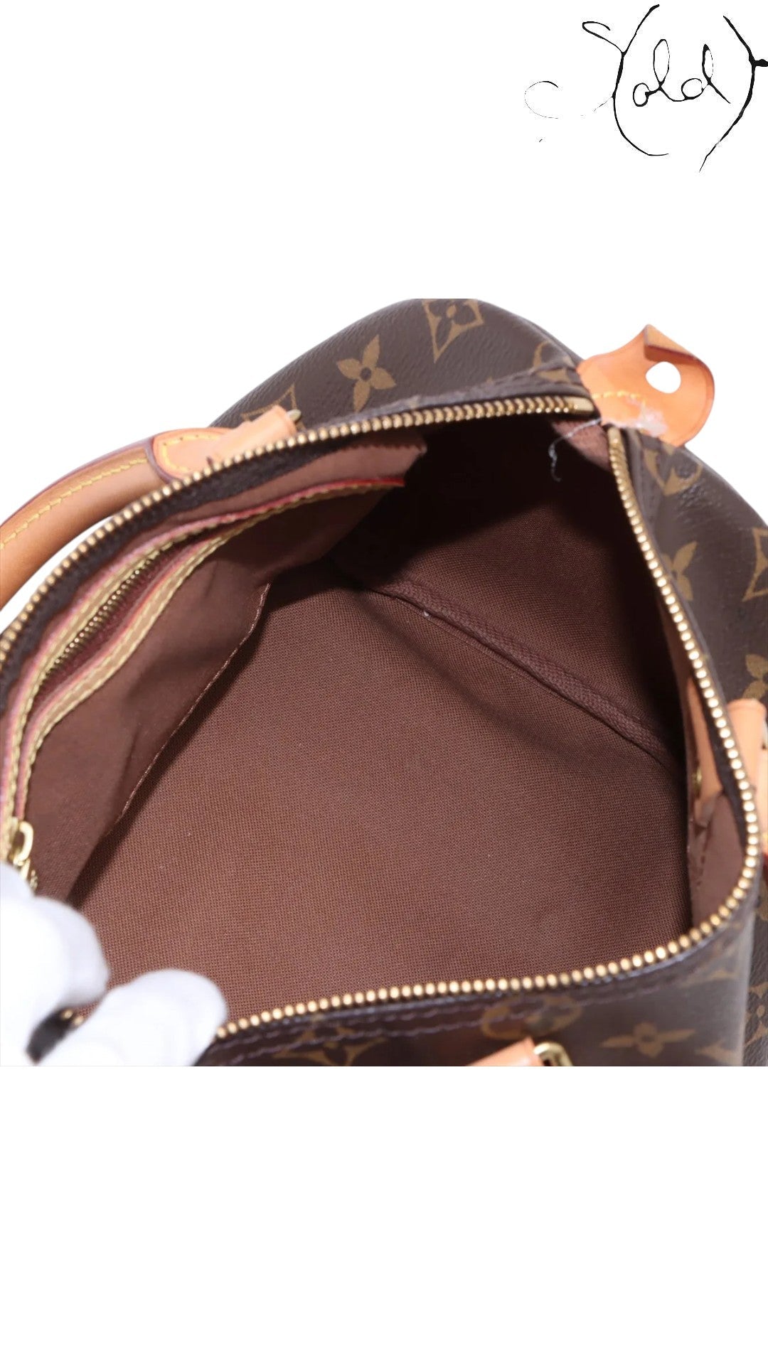Sold Attire Louis Vuitton Speedy 25 Monogram Canvas brown textile interior with leather trim and gold-tone zipper.
