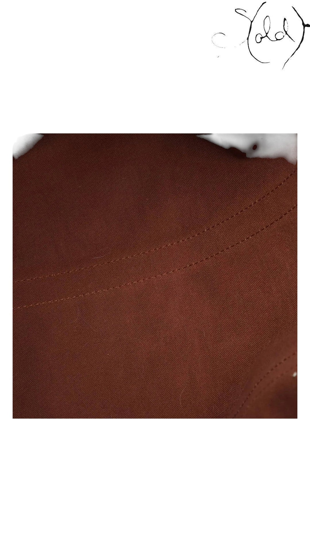 Brown cotton textile interior lining of a vintage Louis Vuitton Keepall travel bag from Sold Attire
