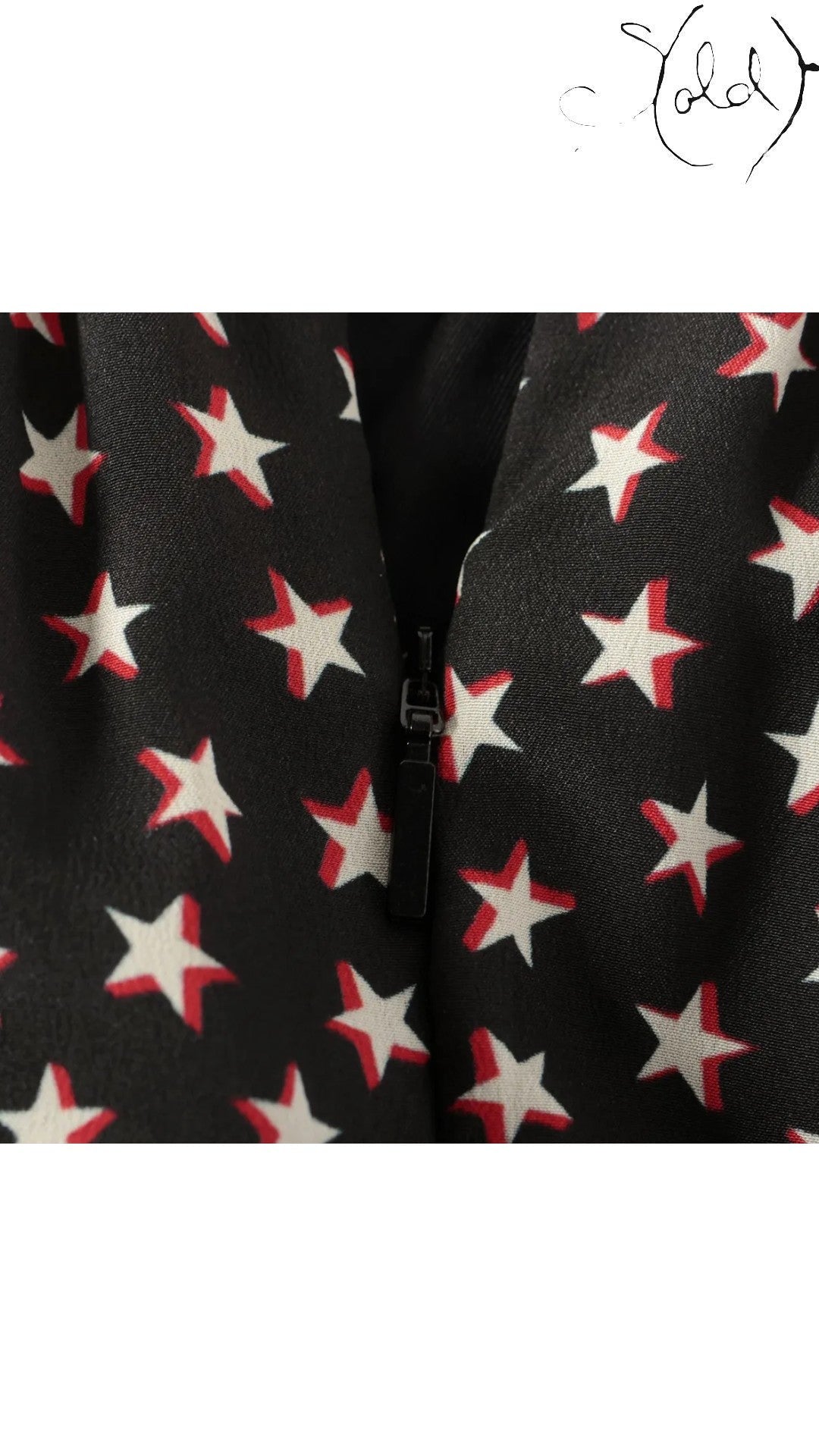 Sold Attire Saint Laurent black silk twill skirt with a white and red star print, featuring a concealed back zipper.