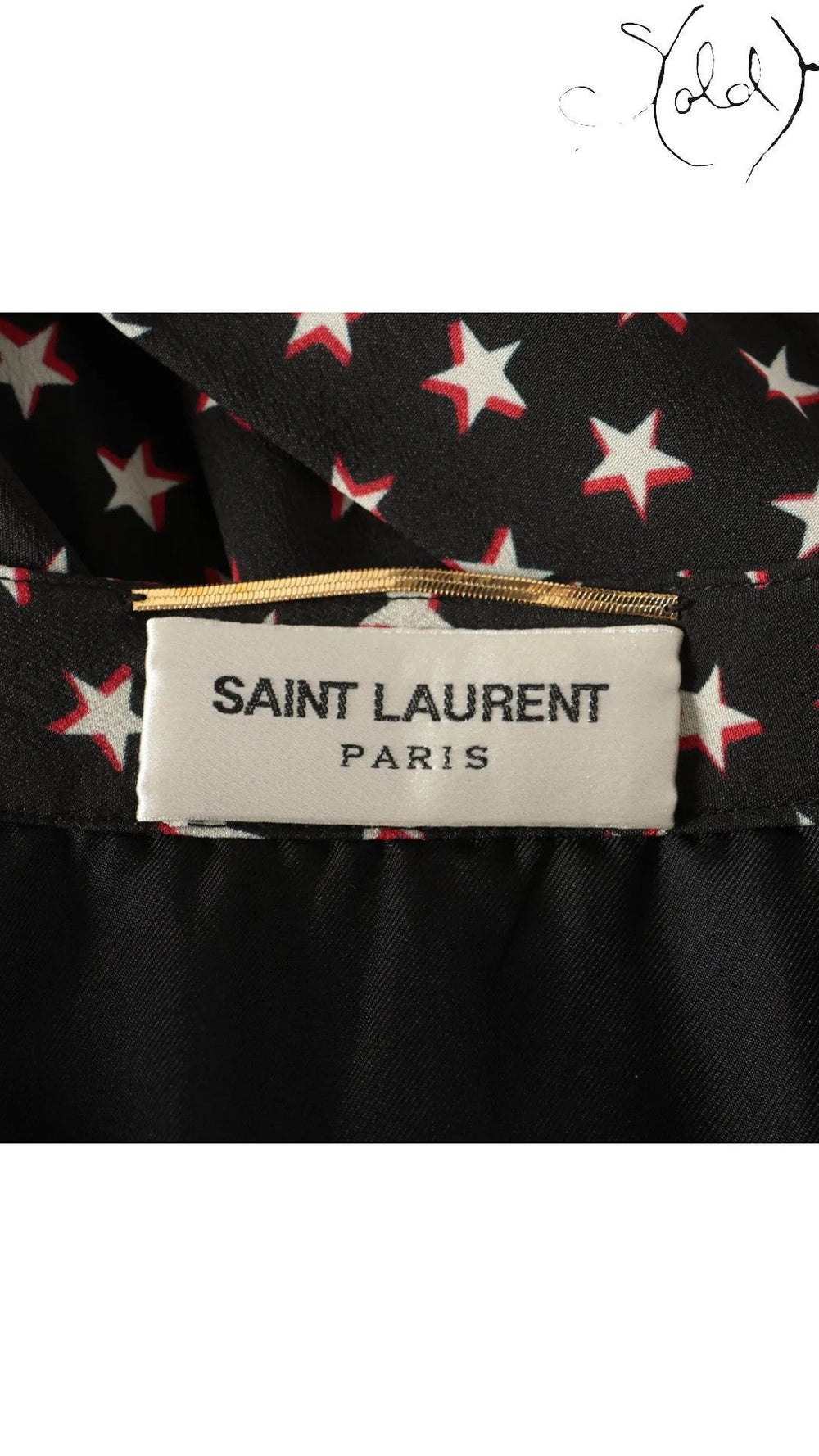 Sold Attire black Saint Laurent silk twill skirt with white and red star print, size FR 38.