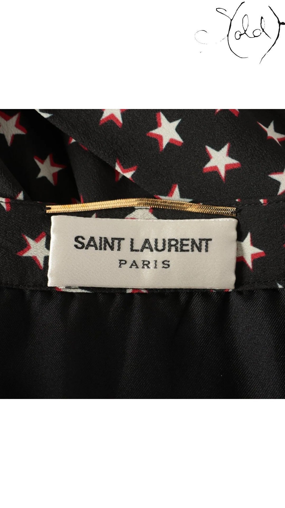 Sold Attire black Saint Laurent silk twill skirt with white and red star print, size FR 38.