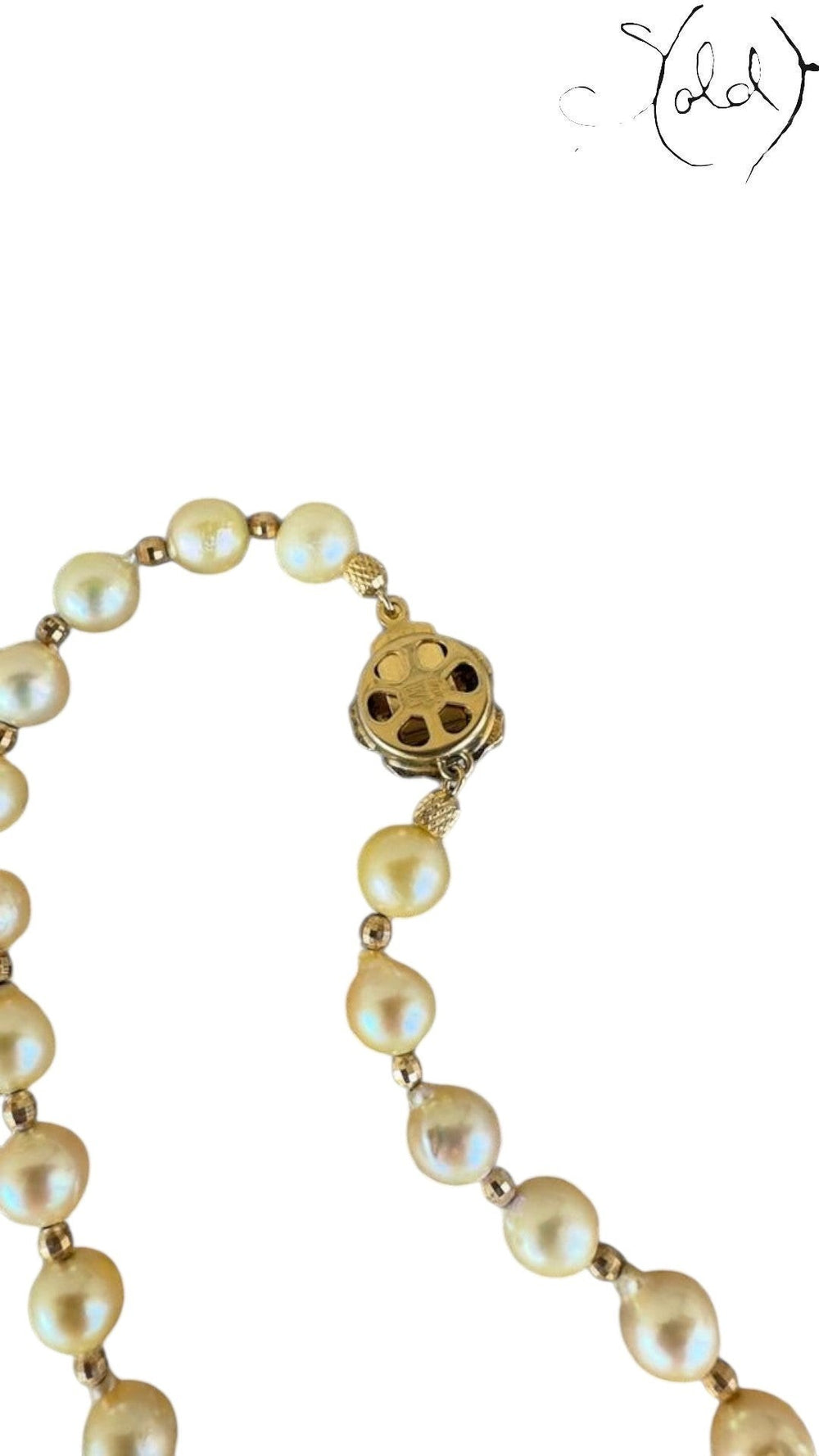 Sold Attire cream Akoya pearl necklace and bracelet set featuring detailed silver SV clasps on a textured fabric background
