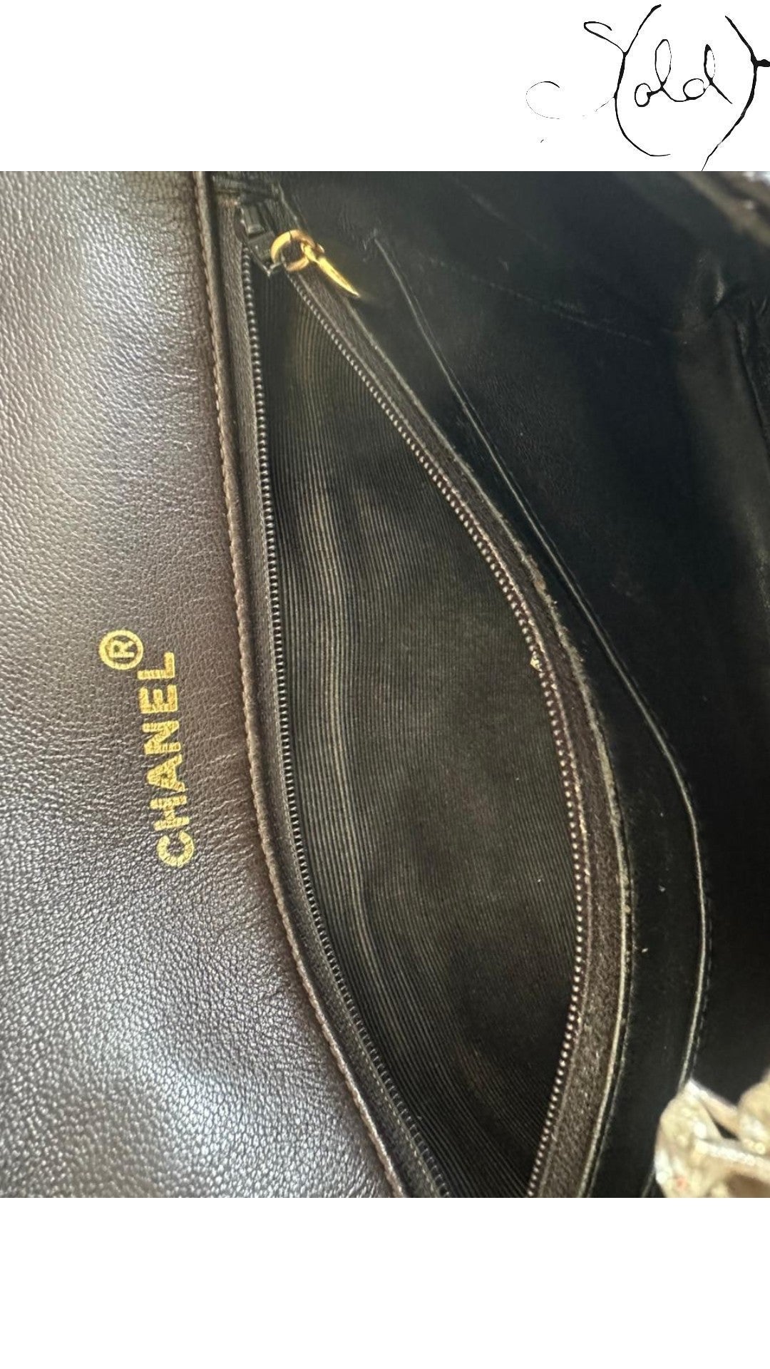 Sold Attire chocolate brown quilted lambskin Chanel Classique Single Full Flap bag interior with gold zipper and embossed logo.