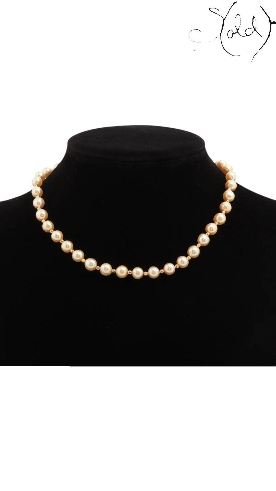 Sold Attire cream Akoya pearl necklace displayed on a black mannequin bust featuring a classic round pearl design.