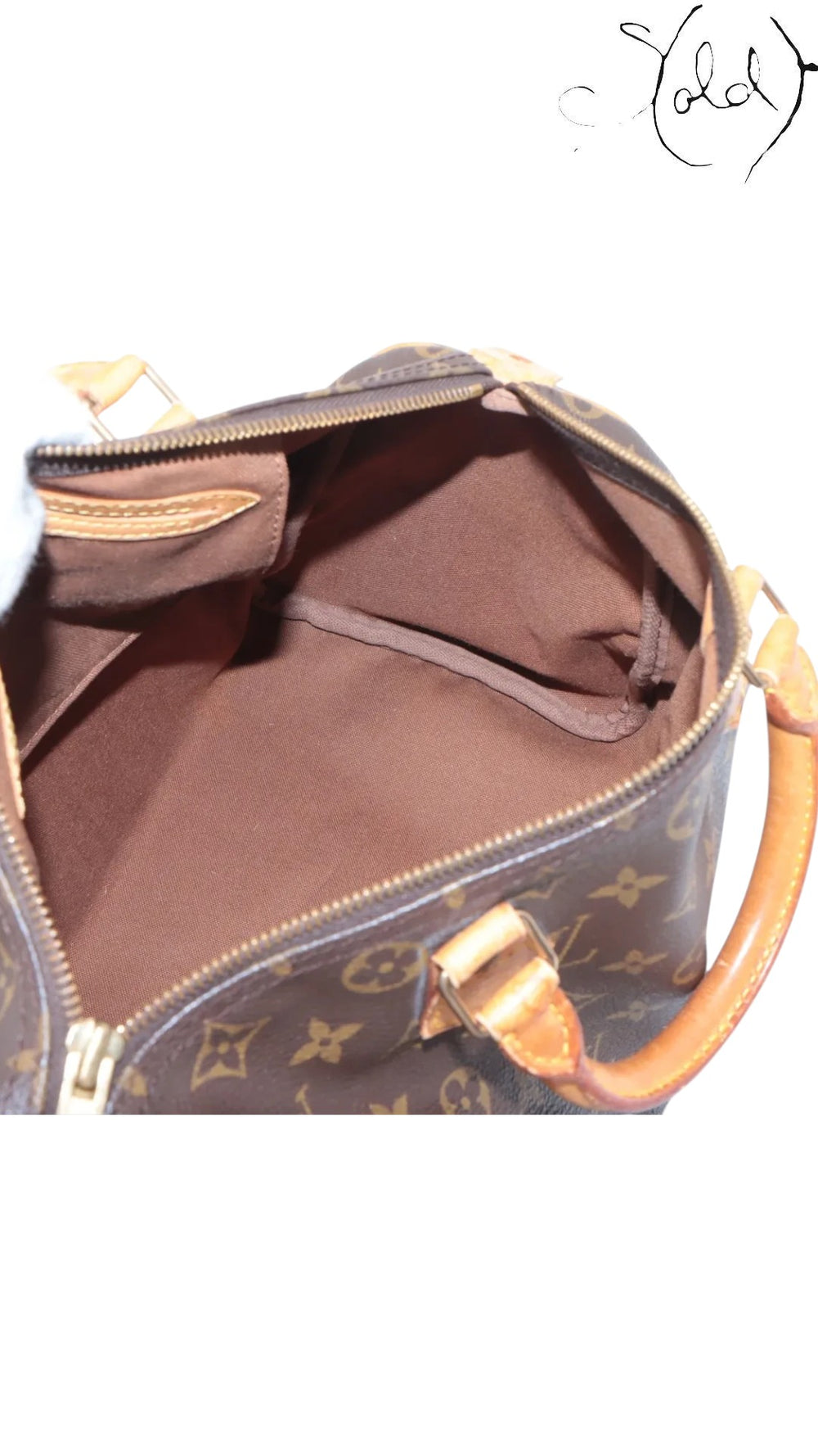 Interior view of a vintage Sold Attire Louis Vuitton Speedy 30 bag showing the clean brown textile lining