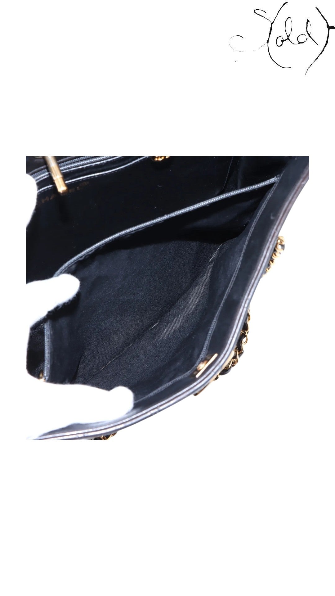 Sold Attire black lambskin Chanel CC Turn-Lock Quilted Chain Tote with gold hardware, interior view.