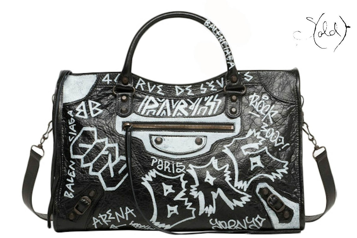 Balenciaga City graffiti bag centred on Sold Attire blog canvas.