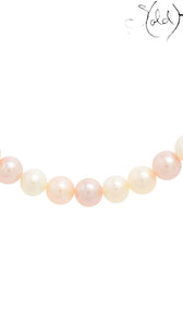 Sold Attire Akoya pearl necklace featuring a strand of lustrous pink and peach pearls with a delicate, rounded shape.