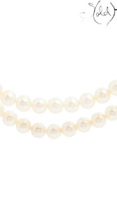 Sold Attire Akoya white two-row pearl necklace with a floral clasp. Pearls are lustrous white with warm cream undertones.
