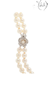 Sold Attire Akoya white two-row pearl necklace with SV floral clasp. Pearls are white to warm cream.