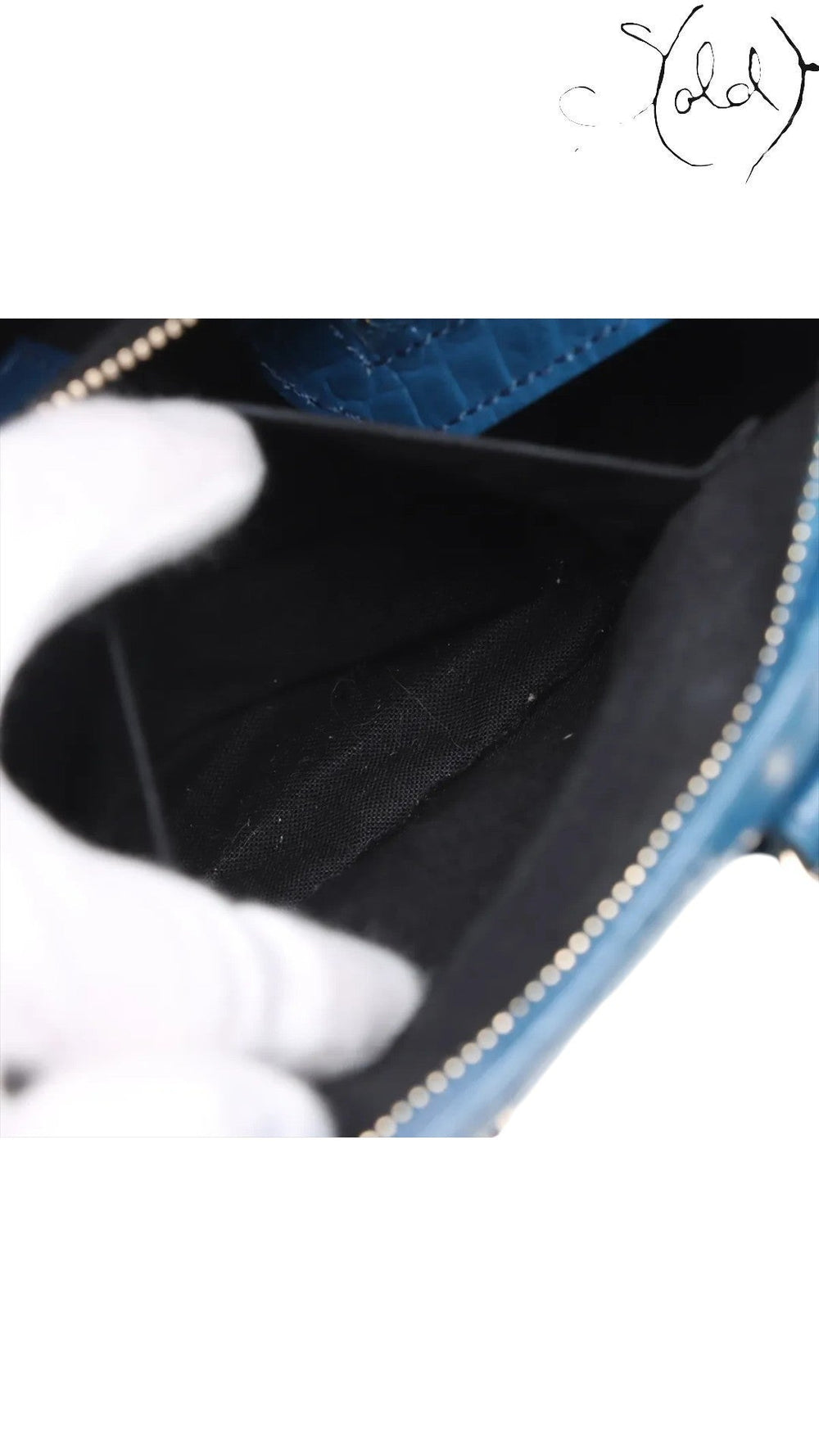 Sold Attire Balenciaga City bag interior showing black fabric lining and Bleu Marine crocodile-embossed leather trim