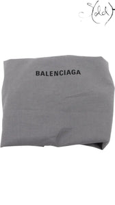 Sold Attire grey fabric Balenciaga dust bag with black logo print, used for storing luxury handbags.