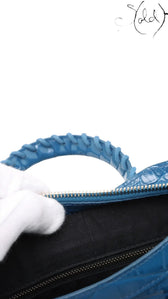 Sold Attire Balenciaga City bag in Bleu Marine crocodile-embossed calfskin showing the black fabric interior lining