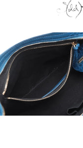 Sold Attire Balenciaga City bag interior featuring black fabric lining, zipper pocket, and blue croc-embossed leather trim.