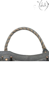 Sold Attire Balenciaga Giant City green leather 2-way bag with braided handle detail and aged metal hardware.