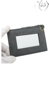 Sold Attire grey distressed leather mirror tag with braided loop and rose gold hardware