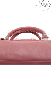 Sold Attire Balenciaga City Giant 12 Rose Bruyere agneau lambskin handbag with braided handle and silver hardware.