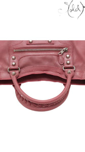 Sold Attire Balenciaga City Giant 12 rose bruyere agneau lambskin handbag with silver hardware and braided handle.