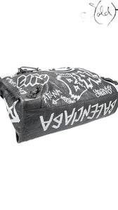 Sold Attire black agneau lambskin Balenciaga Graffiti City bag with white hand-painted graffiti and classic hardware.