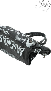Sold Attire black agneau lambskin Balenciaga Graffiti City bag with white hand-painted graffiti details and classic hardware.
