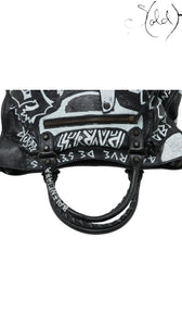 Sold Attire black agneau lambskin Balenciaga Graffiti City Classic Hardware bag with white hand-painted graffiti details and braided handles.