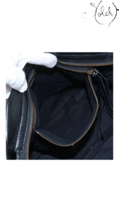 Sold Attire black agneau lambskin Balenciaga Graffiti City bag interior with zip pocket and black cotton lining.