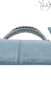 Sold Attire Balenciaga Part Time handbag in Bleu Glacier lambskin with rose gold hardware and braided handle detail.